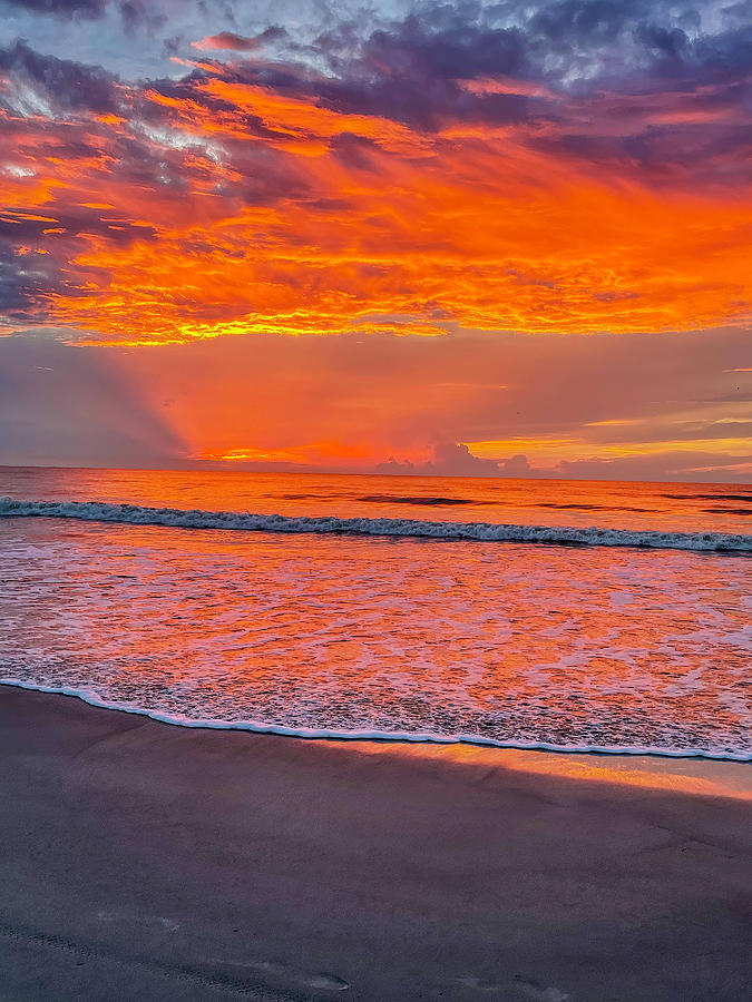 Early morning sunrise display of color on the beach Photograph by Dan Friend