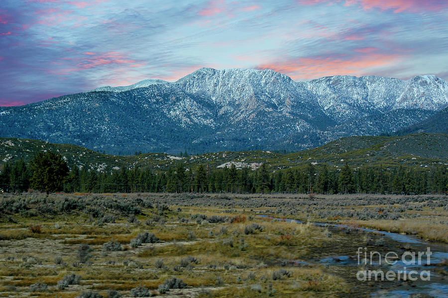 Early morning sunrise over the San Gabriel Mountains with fresh dusting of snow. Photograph by Gunther Allen