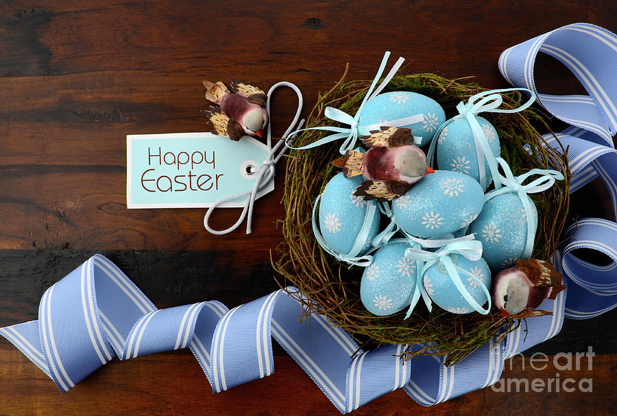 Easter birds nest with blue eggs. Photograph by Milleflore Images