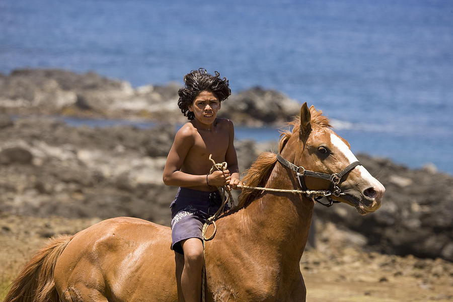 Easter Island, Native boy riding horse Photograph by Michael Dunning