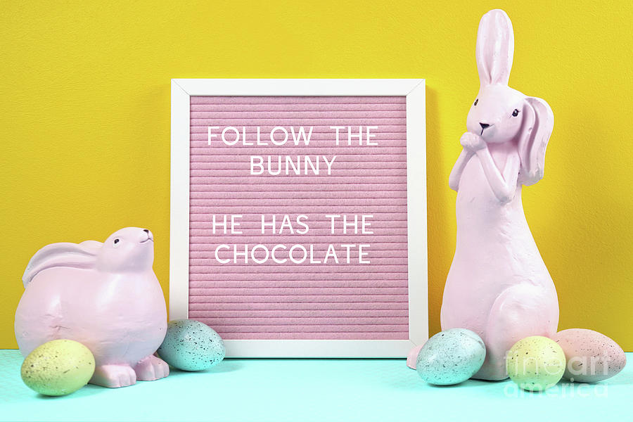 Easter product mockup with pink bunnies, easter eggs against yel Photograph by Milleflore Images