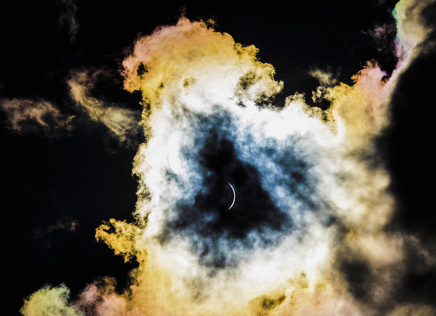 Eclipse Between the Clouds Photograph by Karen Cox