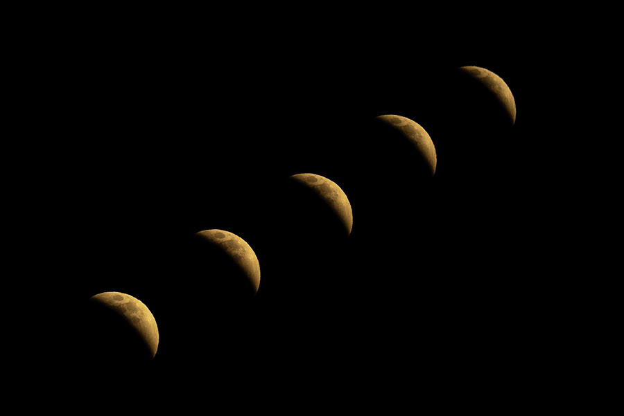 Eclipse Progression Photograph by Peter Tellone