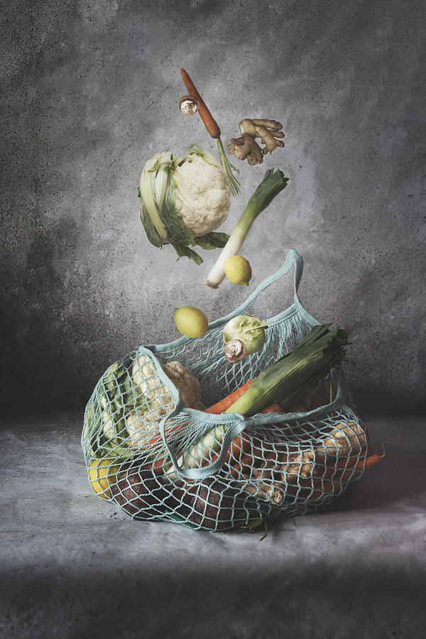 Eco friendly shopping mesh bag with various vegetables. Zero waste Photograph by Vicuschka
