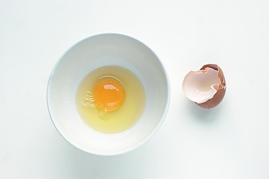 Egg in a white round bowl Photograph by Gregoria Gregoriou Crowe fine art and creative photography.