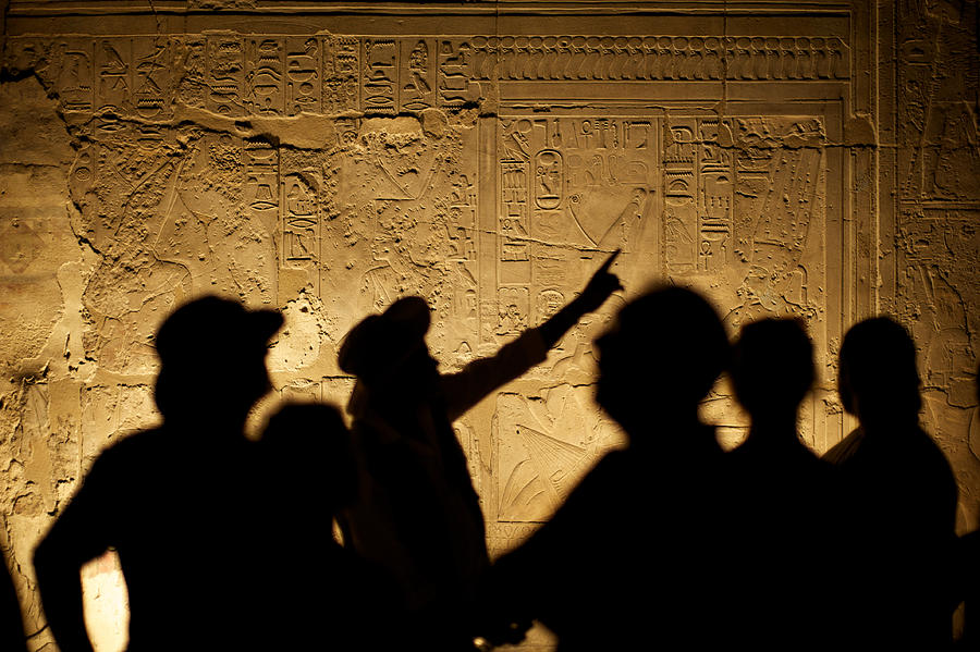 Egyptian Hieroglyphs with Tourist Archeologist Silhouettes Photograph by PeskyMonkey