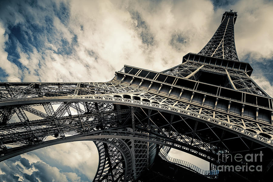 Eiffel Tower with blue sky and cloud background. Low angle view  Photograph by Jane Rix