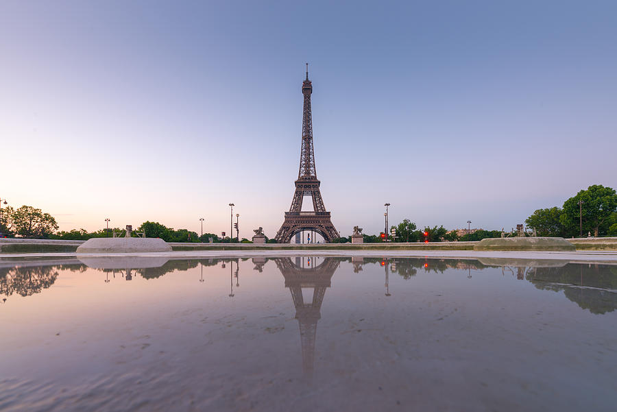 Eiffel tower with reflection at Trocadero fountains Photograph by Coolbiere Photograph