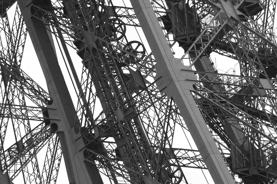 Eiffel Tower Workings - Black and White Photograph by Ron Berezuk