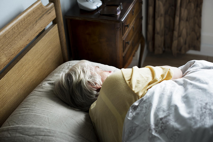 Elderly caucasian woman sleeping on the bed Photograph by Rawpixel