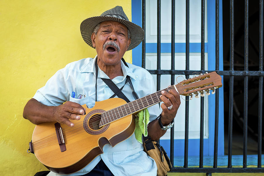 Elderly man playing traditional cuban music in Old Havana Photograph by Karel Miragaya
