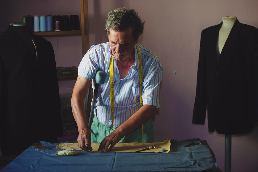 Elderly man sewing Photograph by F.J. Jimenez