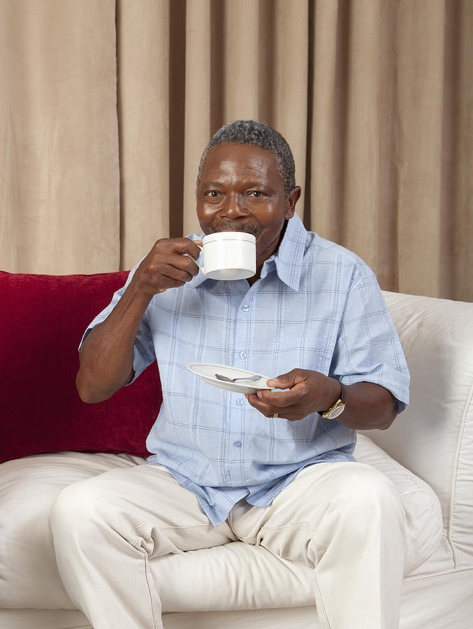 Elderly man sipping his tea, Johannesburg, South Africa Photograph by Gallo Images - LKIS
