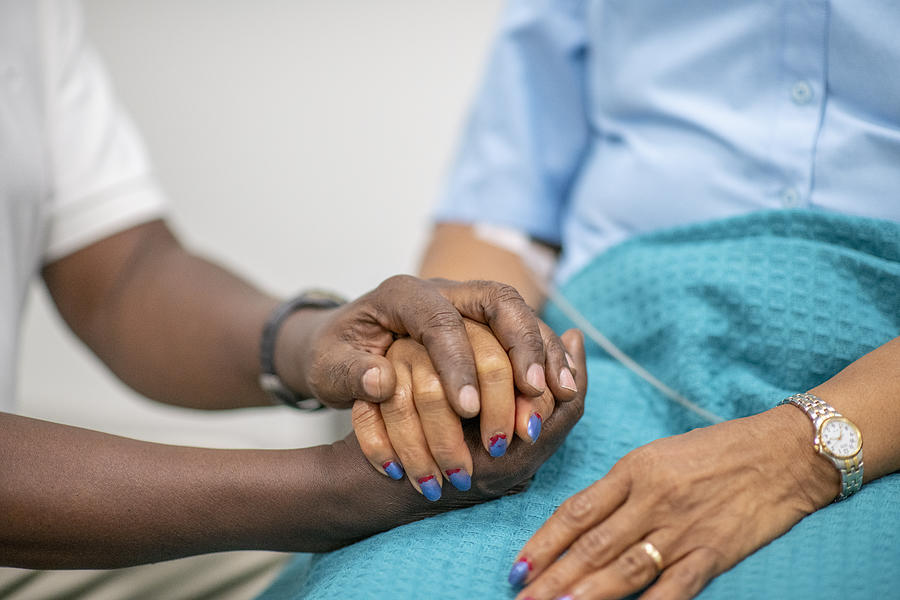Elderly Patient is Comforted by Medical Personnel stock photo Photograph by FatCamera
