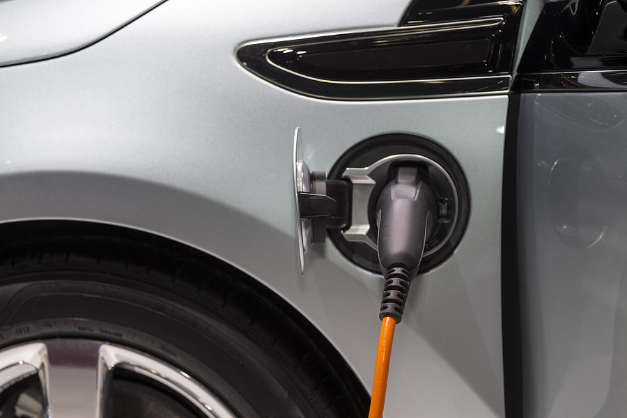 Electric car/vehicle recharging Photograph by Mseidelch