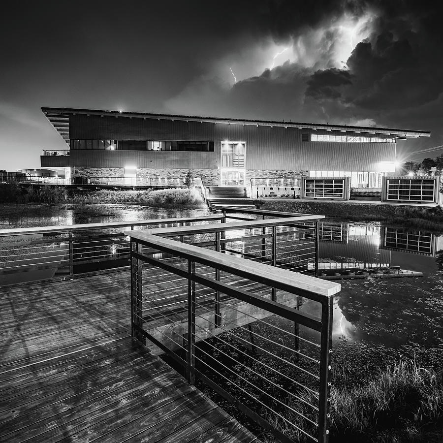 Electric Night Over Lake Bentonville And Thaden Fieldhouse - Black and White 1x1 Photograph by Gregory Ballos