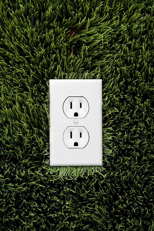 Electric outlet in grass Photograph by John Block