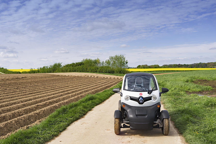 Electric Renault Twizy 45 driving on  rural road in Belgium Photograph by Brytta