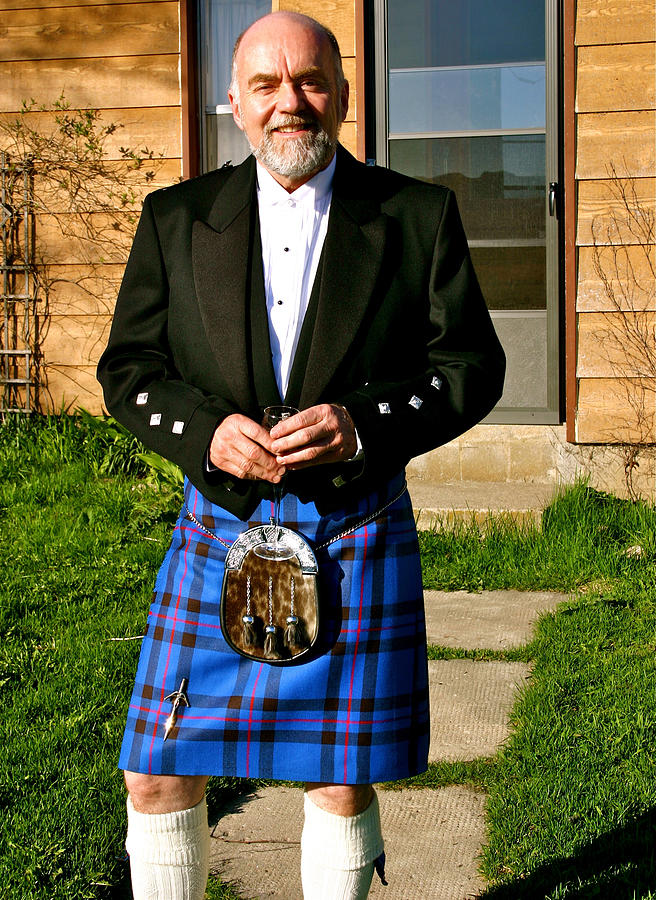 Elegant man in kilt, with champagne Photograph by Judy Bishop - The Travelling Eye