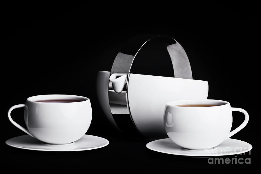 Elegant tea set on black background Photograph by Mendelex Photography