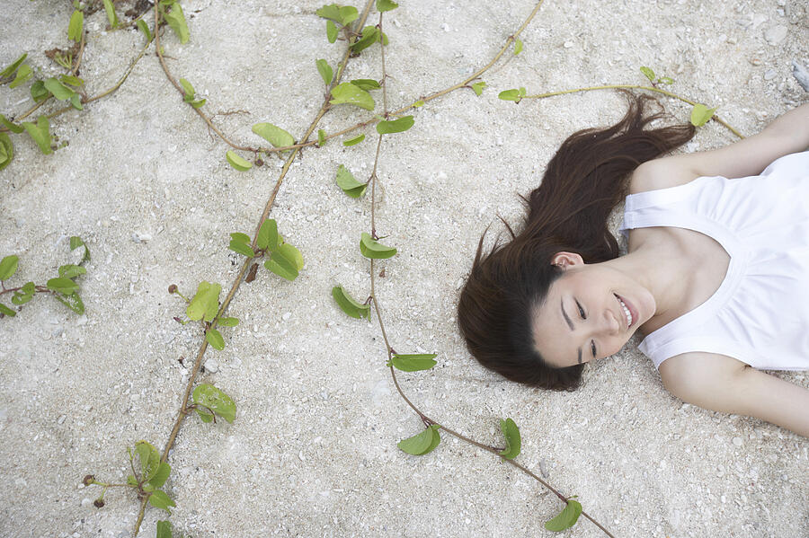 Elevated View of a Woman Lying on Sand Photograph by Dex