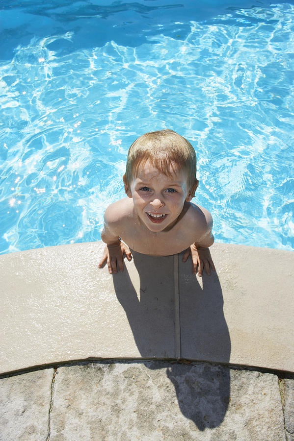 Elevated View of a Young Boy in a Swimming Pool Photograph by Digital Vision.