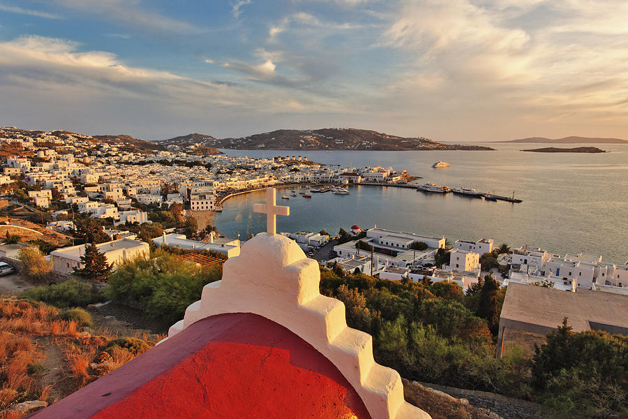 Elevated view of Mykonos Harbor at sunset Photograph by Adam Jones
