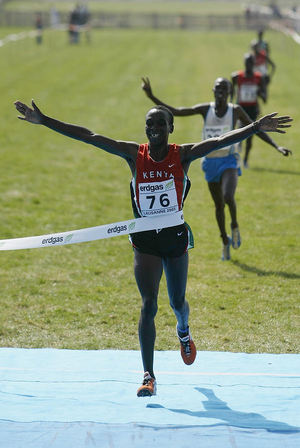 Eliud Kipchoge of Kenya celebrates winning the mens Junior race Photograph by Ian Walton