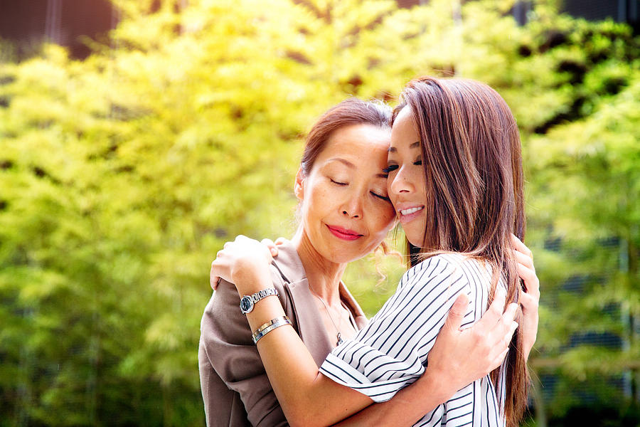 Emotional reunion between Japanese mother and daughter Photograph by NicolasMcComber