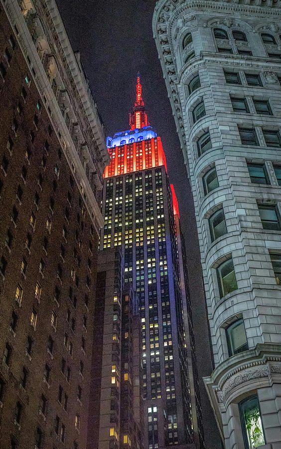 Empire State Building lights Photograph by Jeffrey Friedkin
