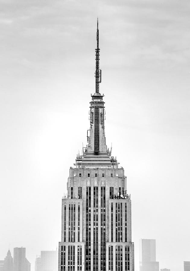 Empire State Building spire close up in black and white Photograph by Az Jackson