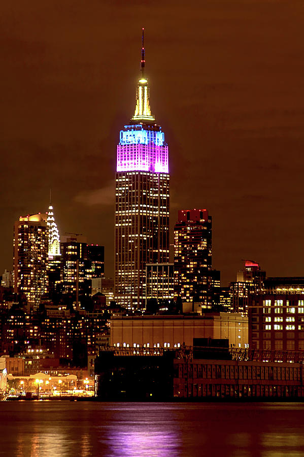 Empire state building with color pink and blue Photograph by Habib Ayat