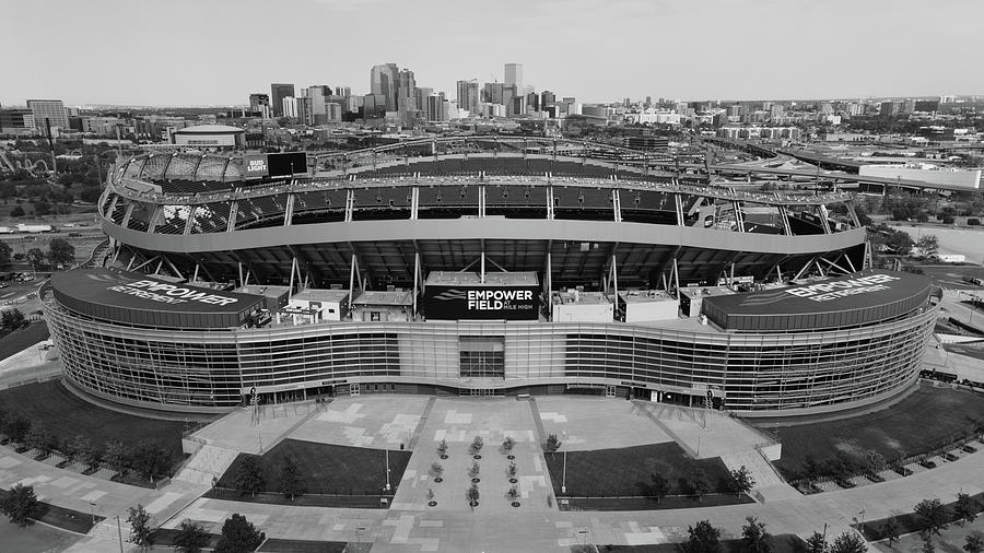 Empower Field at Mile High Stadium with Denver Skyline in black and white Photograph by Eldon McGraw