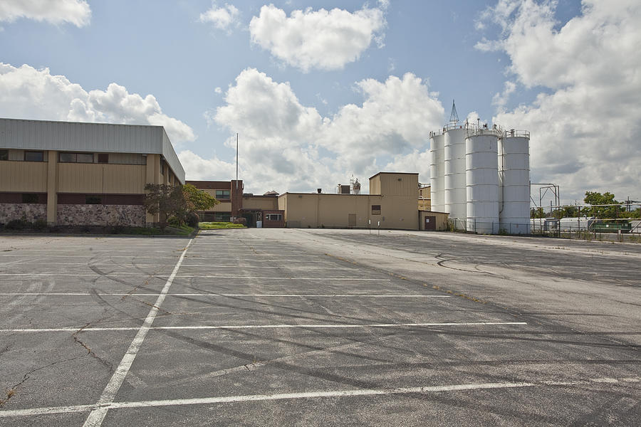 Empty factory parking lot Photograph by Thorney Lieberman