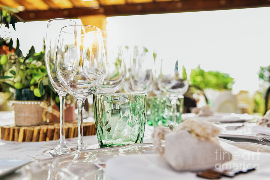 Empty glasses next to the cutlery and table linen of a guest table. Photograph by Joaquin Corbalan