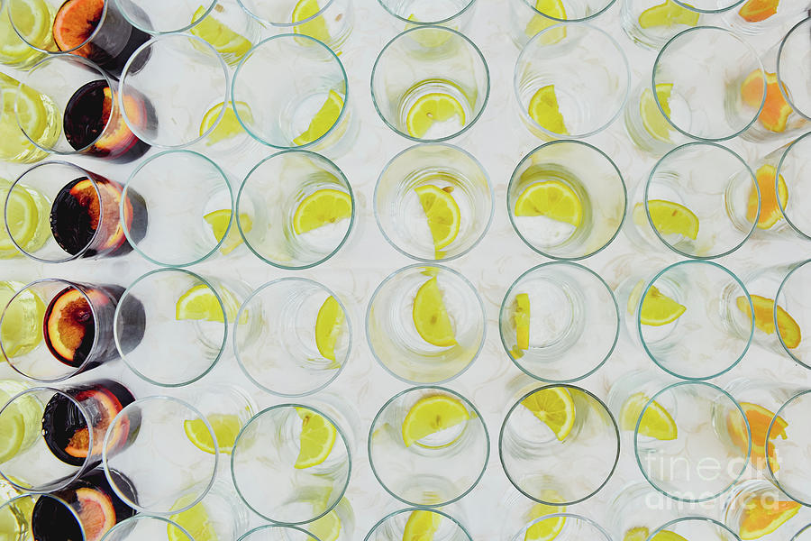 Empty glasses of liquor with lemon pieces sorterend by the bartender. Photograph by Joaquin Corbalan