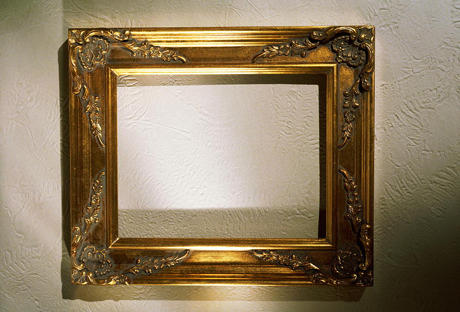 Empty Gold Picture Frame On A Wall Photograph by Chuck Plante
