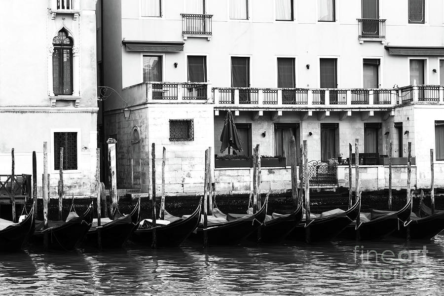 Empty Gondolas in Venice Photograph by John Rizzuto