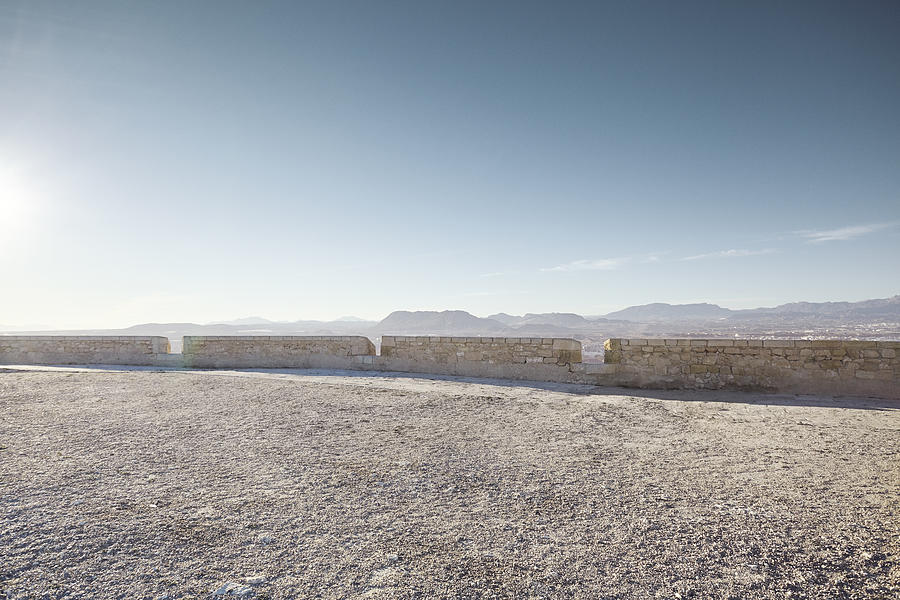 Empty gravel plateau with distant mountains for automotive placement Photograph by James ONeil