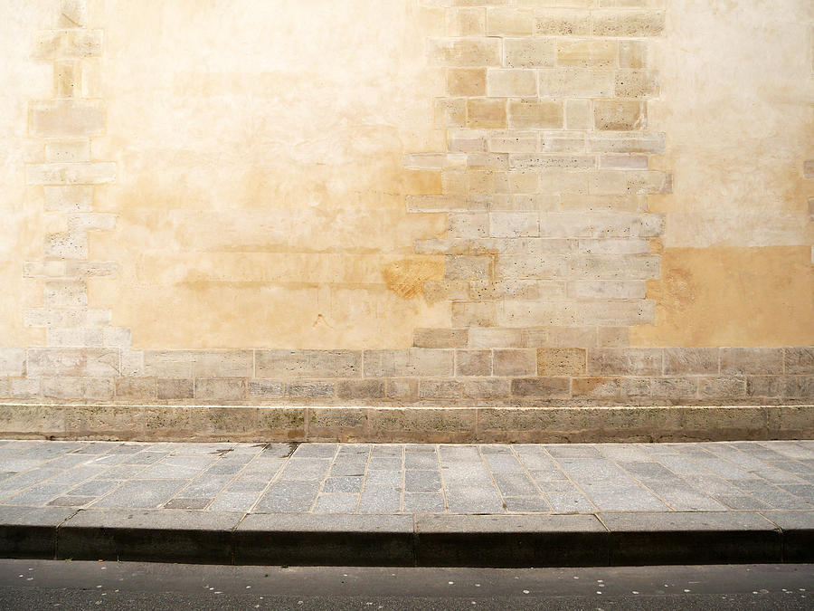 Empty Haussmann facade with paved sidewalk and street in Paris Photograph by Colors Hunter - Chasseur de Couleurs