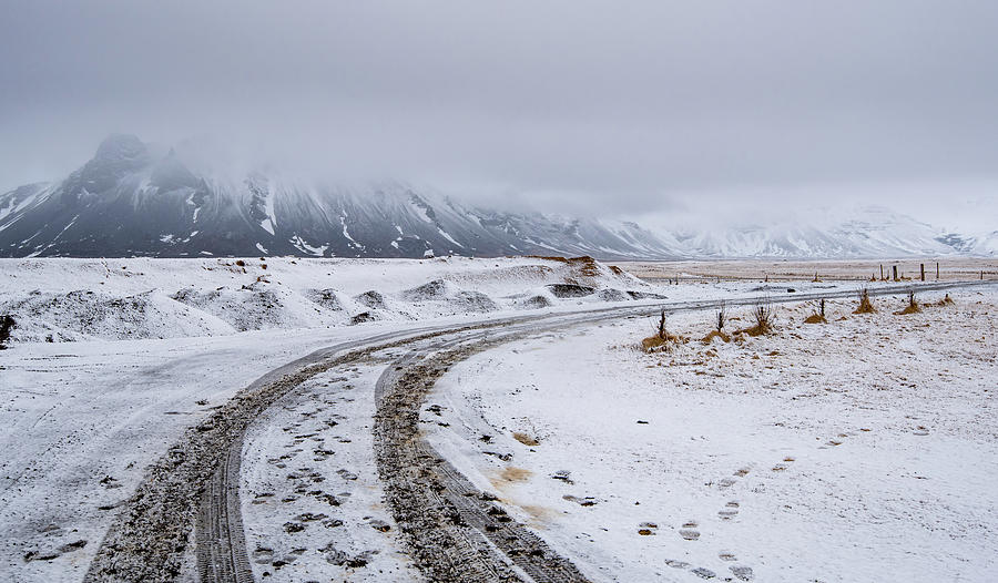 Empty highway countryside road with snow in winter in Iceland Photograph by Michalakis Ppalis