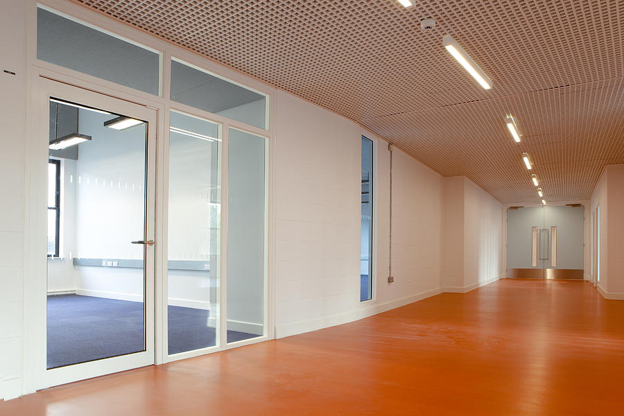 Empty office space featuring a laminate wood floor corridor Photograph by Dt03mbb