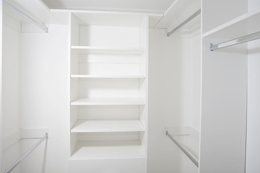 Empty shelves in walk-in closet Photograph by Camilo Morales