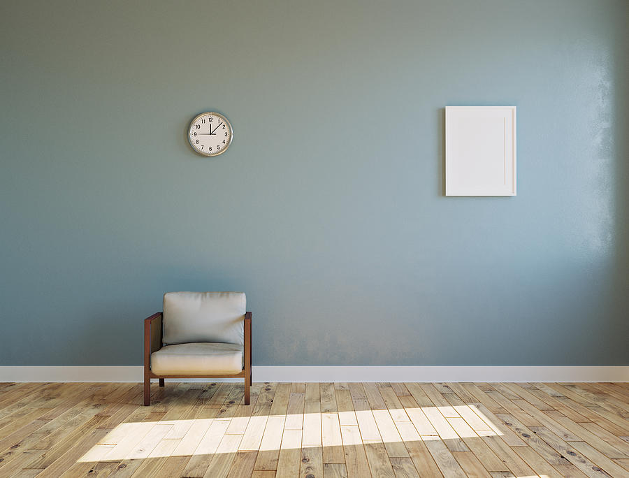 Empty sunlit room with armchair and clock on the wall Photograph by Boris SV