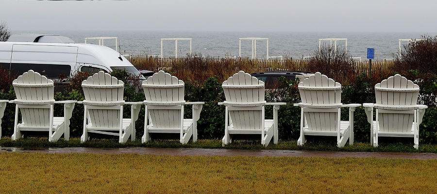 Empty White Adirondack Chairs Facing the Atlantic Ocean in Cape May New Jersey Photograph by Linda Stern
