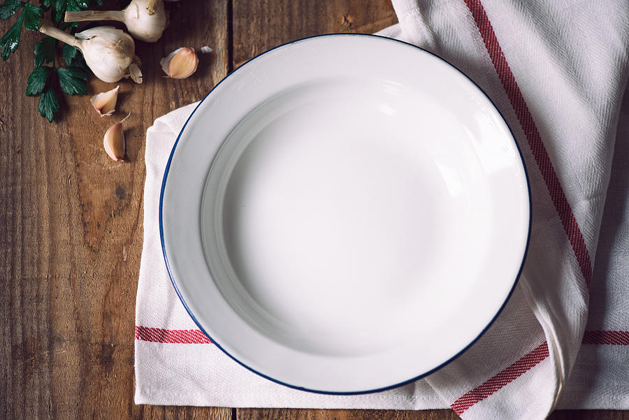 Empty white metal plate with napkin Photograph by Emilija Manevska