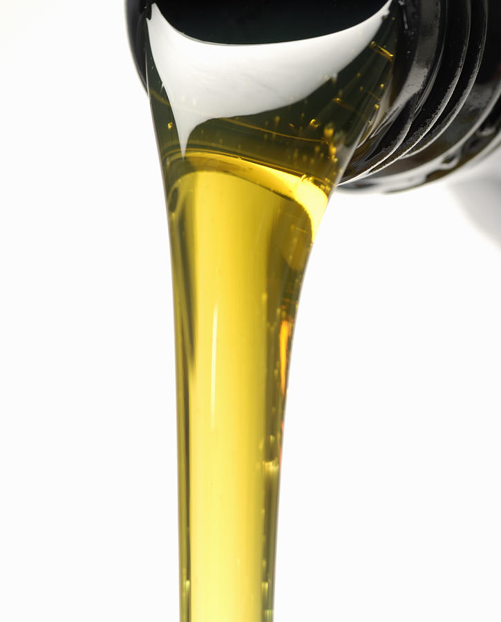 Engine oil and bottle Photograph by Fertnig Engine oil and bottle Photograph by Fertnig