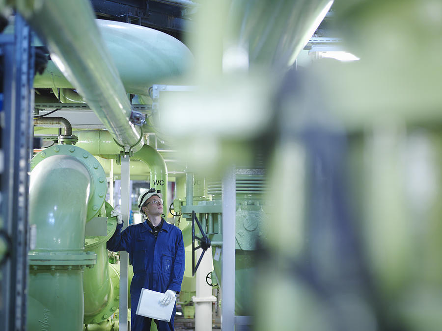Engineer in Turbine Hall Photograph by Monty Rakusen