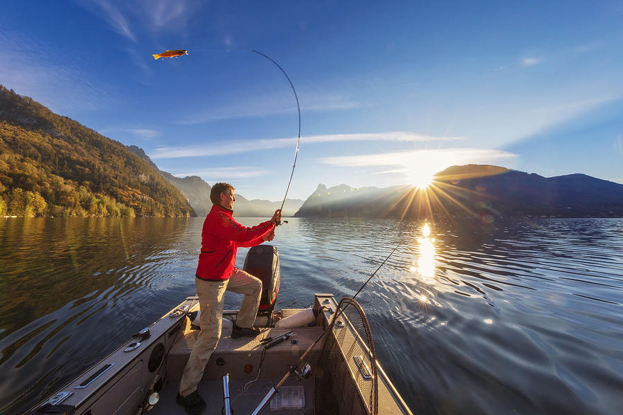 Enjoy my leisure time - fishing at alpin lake Photograph by DieterMeyrl