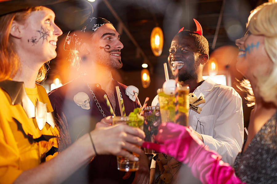 Enjoying Halloween Party in Nightclub Photograph by SeventyFour